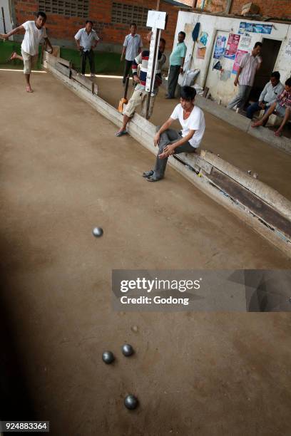 Khmers playing bowls in Battambang. Cambodia.