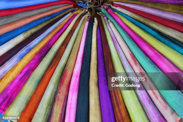 Vietnamese colorful scarf in a row scarves vivid colors stripes. Hoi An. Vietnam.