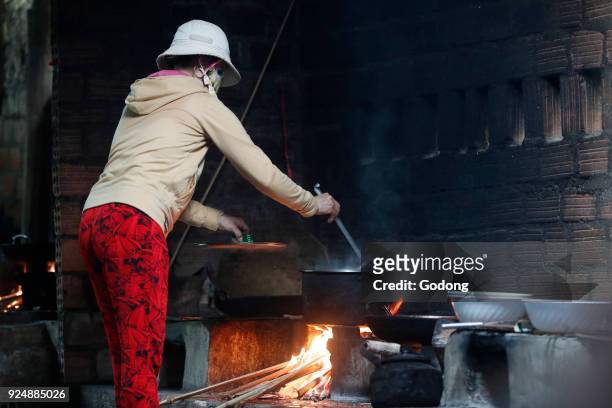 Vietnamese kitchen. Cauldron on fire. Kon Tum. Vietnam.