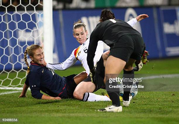 Goalkeeper Hope Solo of USA saves beside of Simone Laudehr of Germany and Lori Chalupny of USA during the Women's International friendly match...