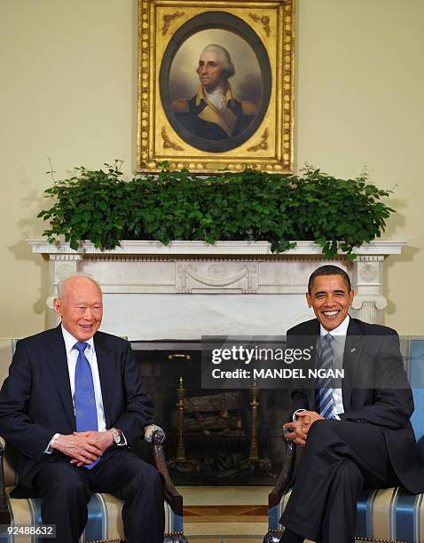 President Barack Obama smiles during a meeting with Singapore Minister Mentor Lee Kuan Yew October 29, 2009 in the Oval Office of the White House in...