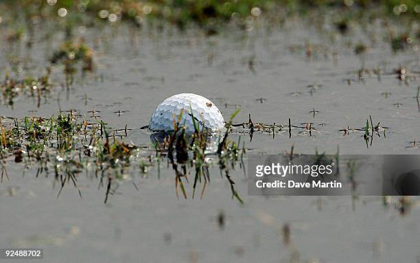 Ball sits partially submerged on the driving range after first round play was postponed in the Viking Classic at the Annandale Golf Club on October...