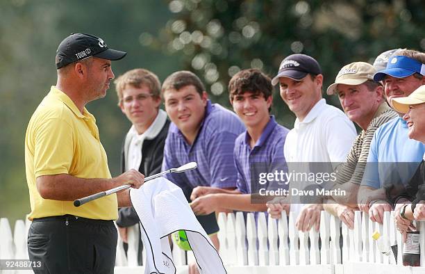 Rocco Mediate talks with fans after first round play was postponed in the Viking Classic at the Annandale Golf Club on October 29, 2009 in Madison,...