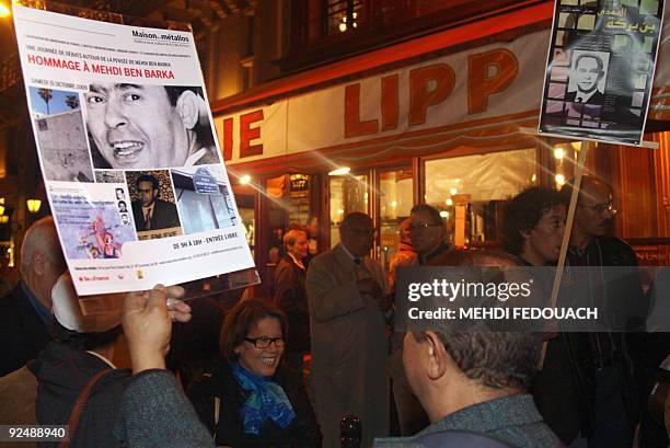 People attend a gathering, organised by the Human Rights League, to mark the 44th anniversary of Moroccan opposition leader Mehdi Ben Barka...