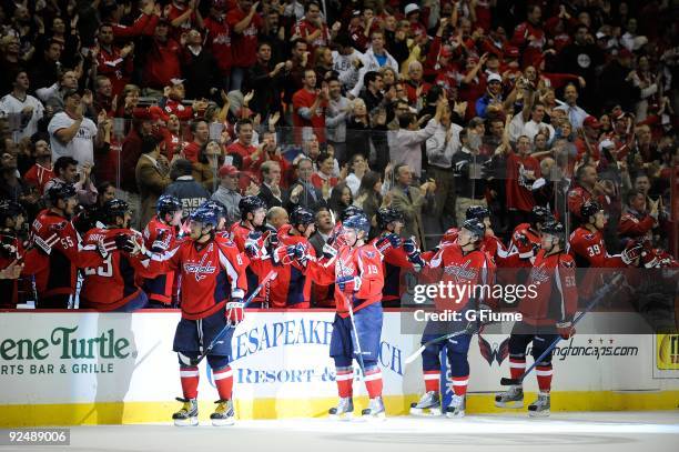 Alex Ovechkin, Nicklas Backstrom, Alexander Semin and Mike Green of the Washington Capitals celebrate with teammates after scoring against the...