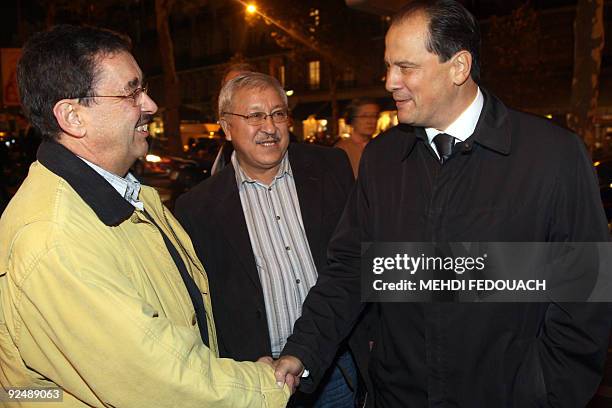 Bechir Ben Barka, , the son of Moroccan opposition leader Mehdi Ben Barka, shakes hands with socialist MP Jean-Christophe Cambadelis during a...