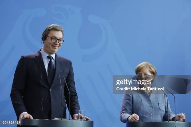 German Chancellor Angela Merkel and Serbian President Aleksandar Vucic address the media during a joint press conference in the German chancellory on...