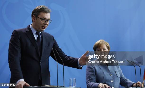 German Chancellor Angela Merkel and Serbian President Aleksandar Vucic address the media during a joint press conference in the German chancellory on...