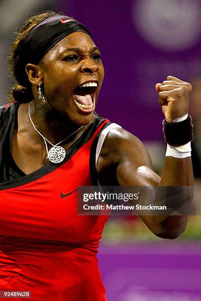Serena Williams of the United States celebrates match point against Elena Dementieva of Russia in round robin play during the Sony Ericsson WTA...