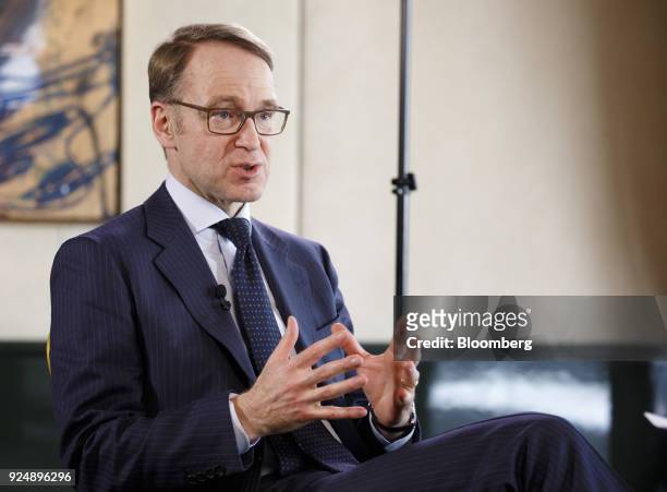 Jens Weidmann, president of the Deutsche Bundesbank, gestures while speaking during a Bloomberg Television interview following news conference to...
