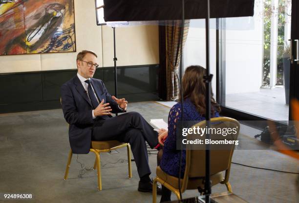 Jens Weidmann, president of the Deutsche Bundesbank, gestures while speaking during a Bloomberg Television interview following news conference to...