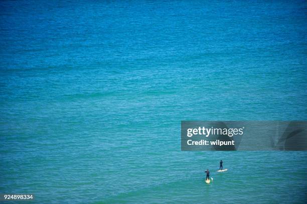 stand up paddle boarding - chasing perfection stock pictures, royalty-free photos & images