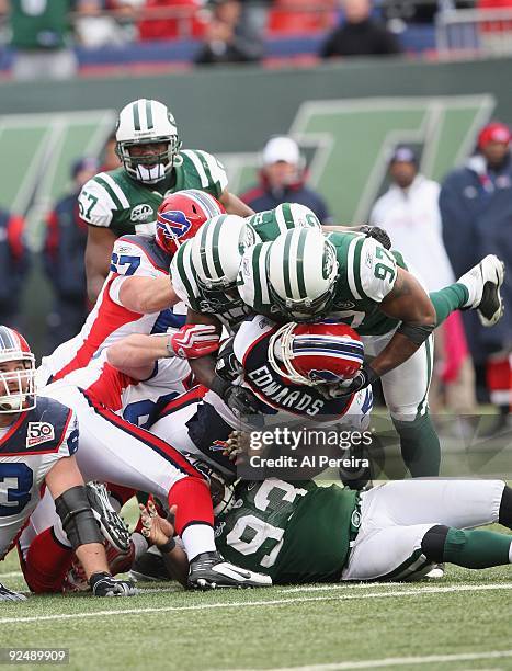 Quarterback Trent Edwards of the Buffalo Bills is sacked and injured by linebacker David Harris, linebacker Calvin Pace and defensive end Marques...