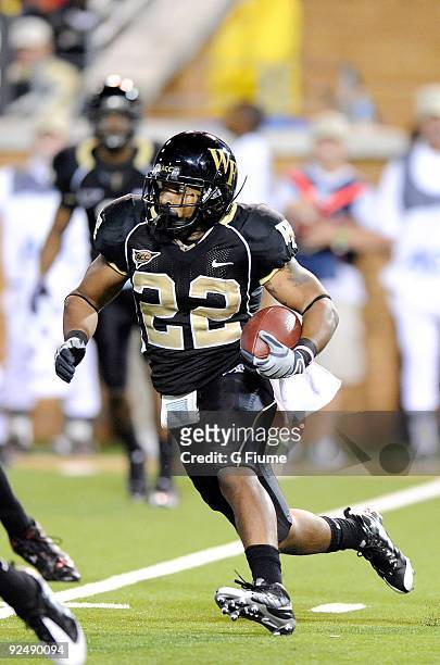 Brandon Pendergrass of the Wake Forest Demon Deacon rushes the ball against the Maryland Terrapins at BB&T Field on October 10, 2009 in Winston...