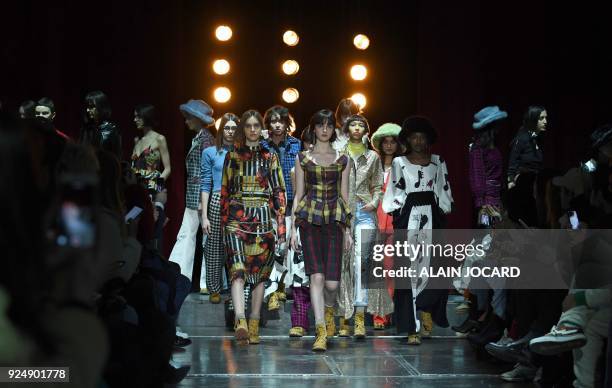Models present creations for JOUR/NE during the 2018/2019 fall/winter collection fashion show on February 27, 2018 in Paris. / AFP PHOTO / ALAIN...