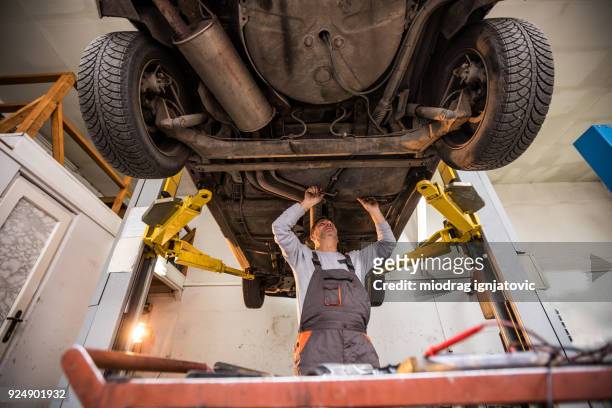 Male Mechanic Fixing Broken Car Indoors High-Res Stock Photo - Getty Images