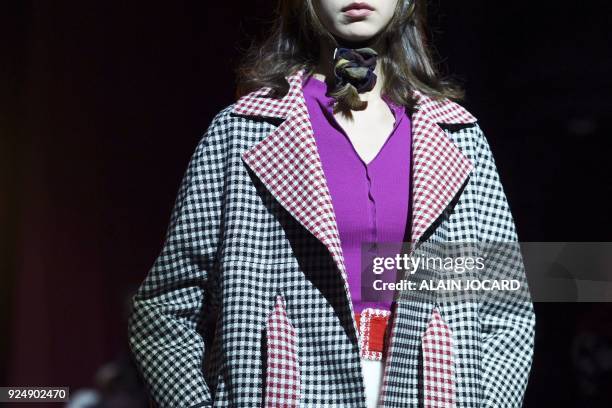 Model presents a creation for JOUR/NE during the 2018/2019 fall/winter collection fashion show on February 27, 2018 in Paris. / AFP PHOTO / ALAIN...