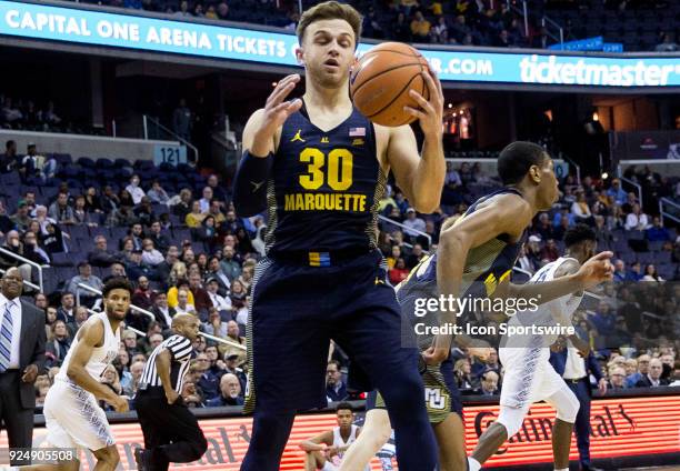 Marquette Golden Eagles guard Andrew Rowsey collects the ball to start an attack during a Big East men's basketball game between the Georgetown Hoyas...