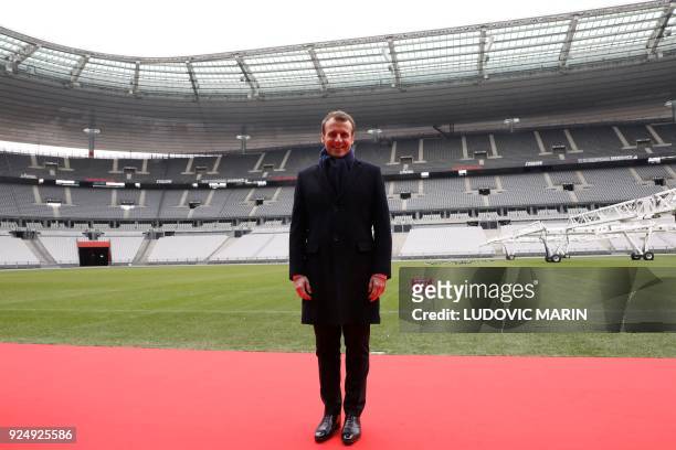 France's president Emmanuel Macron poses during a visit to the Stade de France to attend the inauguration of the Olympic Committee site for the Paris...