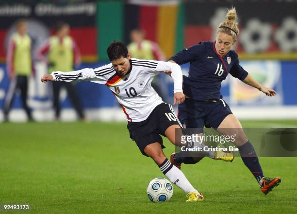 Linda Bresonik of Germany and Ella Masar of USA battle for the ball during the Women's International friendly match between Germany and USA at the...
