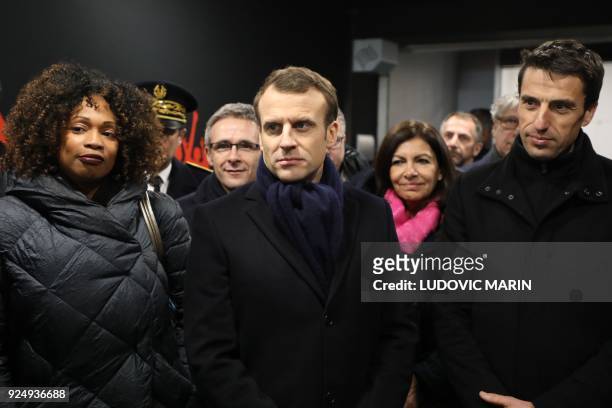 France's president Emmanuel Macron , flanked by Paris mayor Anne Hidalgo , Paris 2024 Games' chief Tony Estanguet , and French Sports Minister Laura...