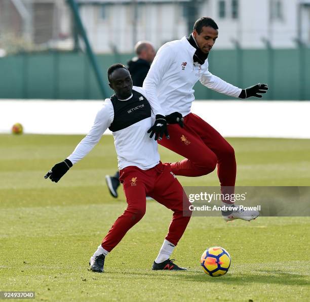Sadio Mane and Joel Matip of Liverpool during a training session at Melwood Training Ground on February 27, 2018 in Liverpool, England.