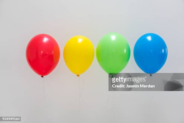 bunch of balloons - helium stock-fotos und bilder