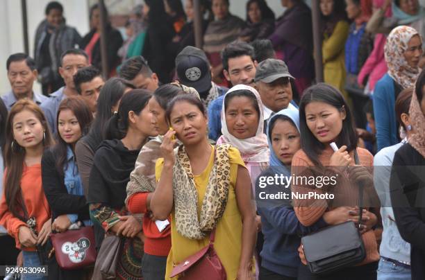 Naga voters stand in queue to cast their vote during the Nagaland Legislative Assembly election at Dimapur, India north eastern state of Nagaland on...