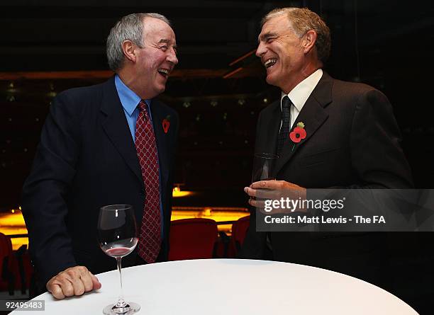 Ex-Football manager Frank Clarke and Sir Trevor Brooking, Director of Football Development at the FA share a joke during the Black List Awards at...