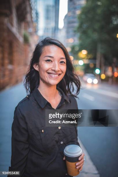 asian woman waiting for taxi in sydney - australia taxi stock pictures, royalty-free photos & images