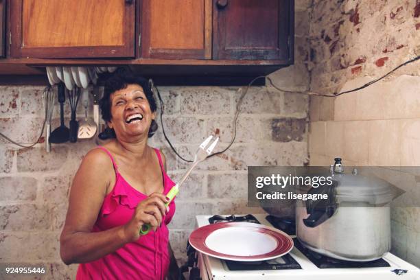 cuban grandmother cooking - cuba food stock pictures, royalty-free photos & images