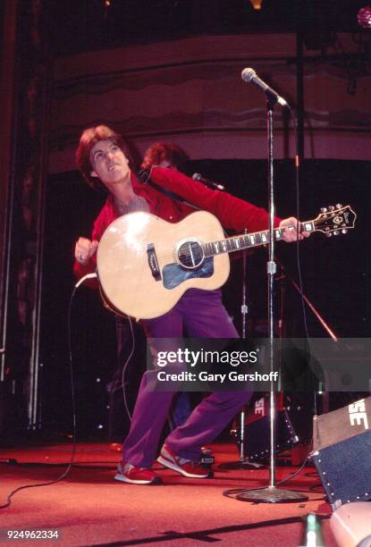 American Rock musician Ricky Nelson plays acoustic guitar as he performs onstage at the Ritz, New York, New York, February 24, 1981.