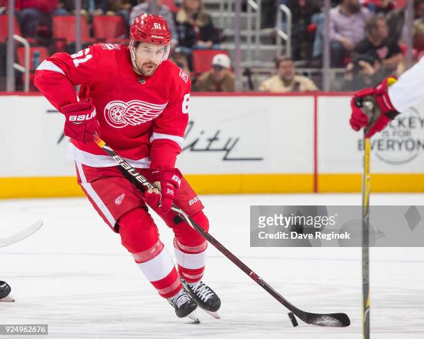 Xavier Ouellet of the Detroit Red Wings controls the puck against the Carolina Hurricanes during an NHL game at Little Caesars Arena on February 24,...