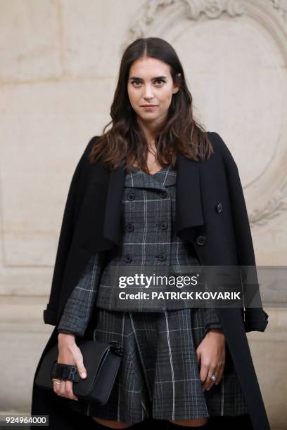 Italian fashion blogger Viola Arrivabene poses for a photo-call before the Christian Dior's 2018/2019 fall/winter collection fashion show on February...