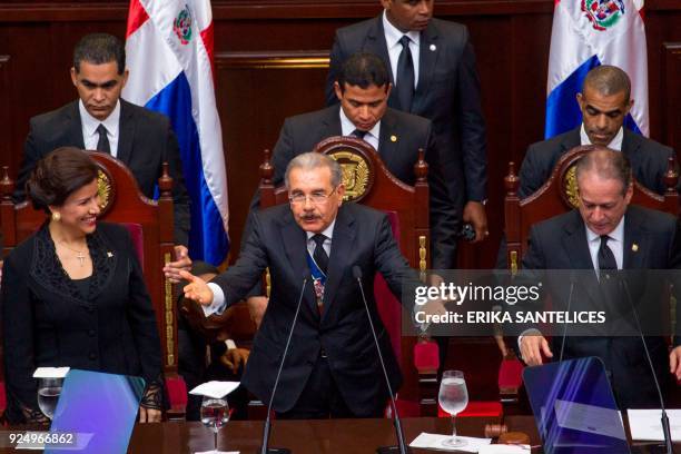 Dominican President Danilo Medina , flanked by Vice-President Margarita Cedeno and Senate President Reinaldo Pared, delivers a speech before the...