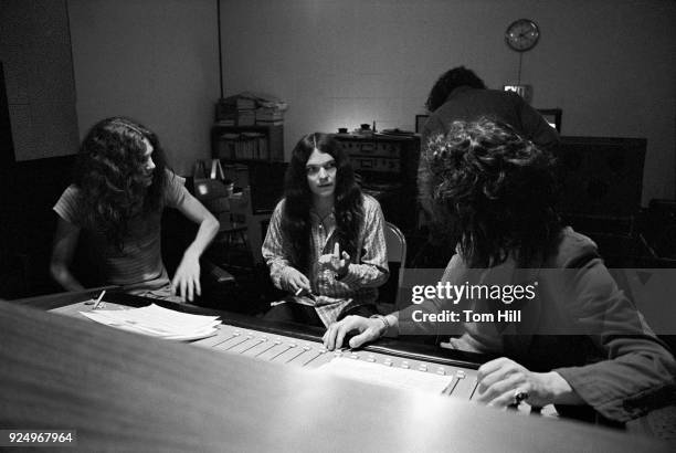 Lynyrd Skynyrd members Allen Collins and Gary Rossington work with producer Al Kooper on "Pronounced Lynyrd Skynyrd" in the control room at Studio I...