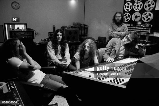 Lynyrd Skynyrd members Ronnie Van Zant, Gary Rossington and Allen Collins work with producer Al Kooper on "Pronounced Lynyrd Skynyrd" with engineer...