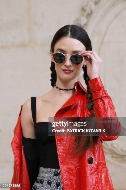 Canadian actress Charlotte Le Bon poses for a photo-call before the Christian Dior's 2018/2019 fall/winter collection fashion show on February 27,...