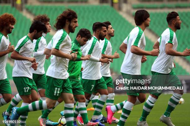Iraqi national football team players take part in a training session on February 27, 2018 in the city of Basra a day ahead of their friendly match...