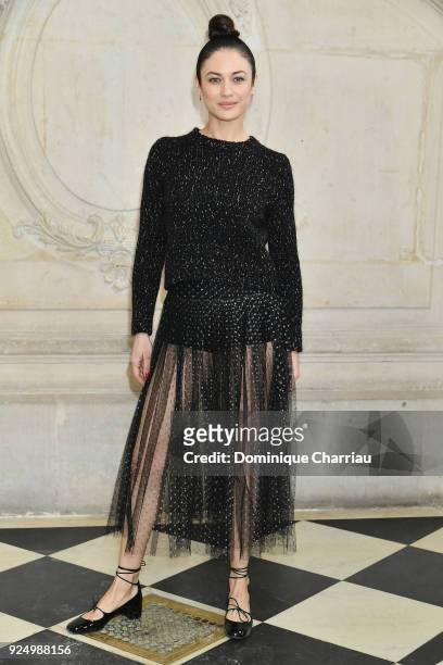 Olga Kurylenko attends the Christian Dior show as part of the Paris Fashion Week Womenswear Fall/Winter 2018/2019 on February 27, 2018 in Paris,...