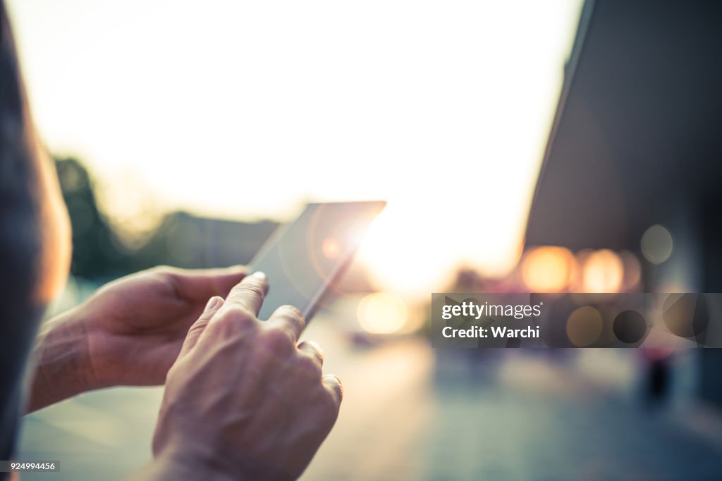 Woman using her mobile phone on the street