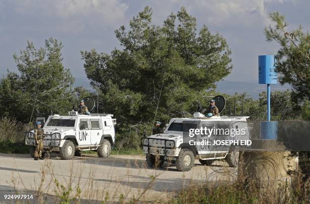 Soldiers form the Italian contingent in the UNIFIL patrol the blue line in Lebanon's southern border town of Naqura on the border with Israel, south...