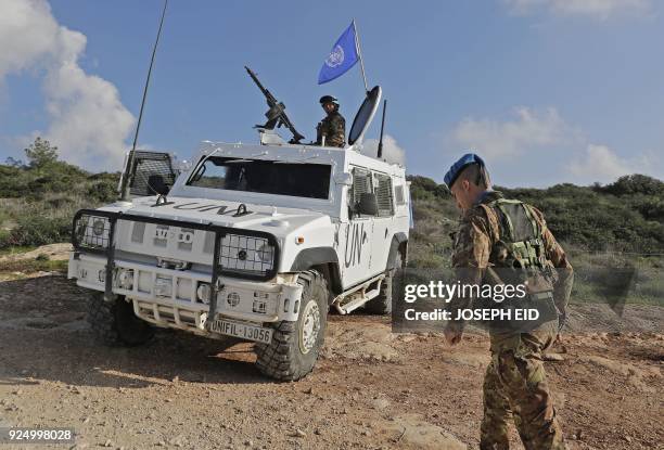 Soldiers form the Italian contingent in the UNIFIL patrol the blue line in Lebanon's southern border town of Naqura on the border with Israel, south...