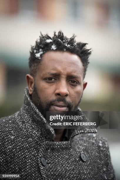 French director Ladj Ly poses under the snow on February 27, 2018 during a portrait session in the "Chene Pointu" council estate in Clichy-sous-Bois,...