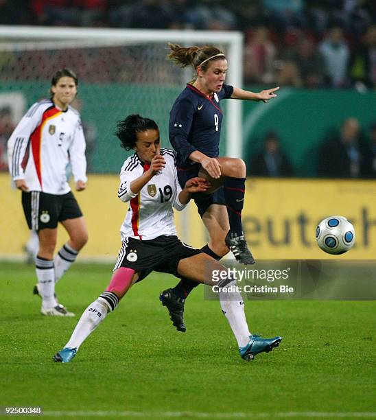 Fatmire Lira Bajramaj of Germany and Heather O'Reilly of USA battle for the ball during the Women's International friendly match between Germany and...