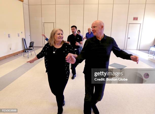 Dance Instructor J Michael Winward, of "Steps In Time," center rear, leads a "Naughty Nookers" dance class at the Center For Active Living in...