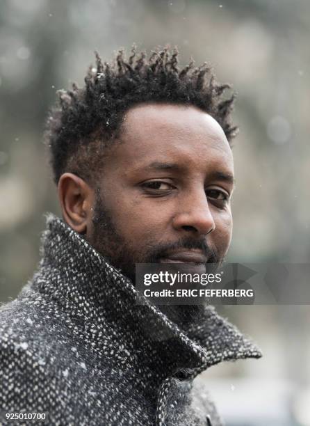 French director Ladj Ly poses under the snow on February 27, 2018 during a portrait session in the "Chene Pointu" council estate in Clichy-sous-Bois,...