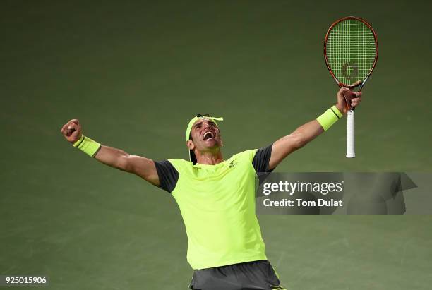 Malek Jaziri of Tunisia celebrates his win against Grigor Dimitrov of Bulgaria on day two of the ATP Dubai Duty Free Tennis Championships at the...