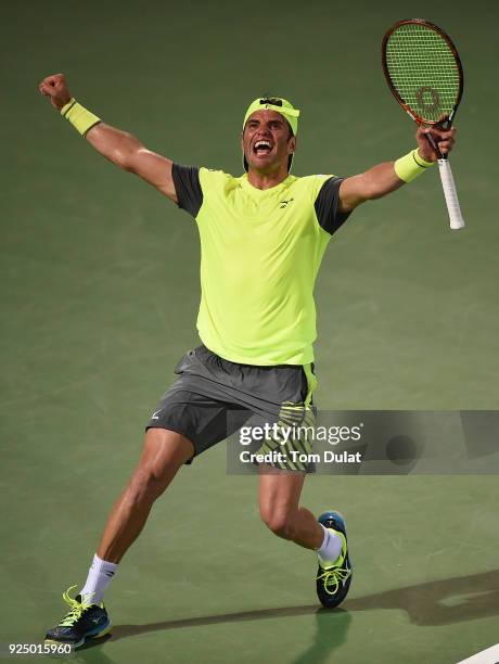 Malek Jaziri of Tunisia celebrates his win against Grigor Dimitrov of Bulgaria on day two of the ATP Dubai Duty Free Tennis Championships at the...