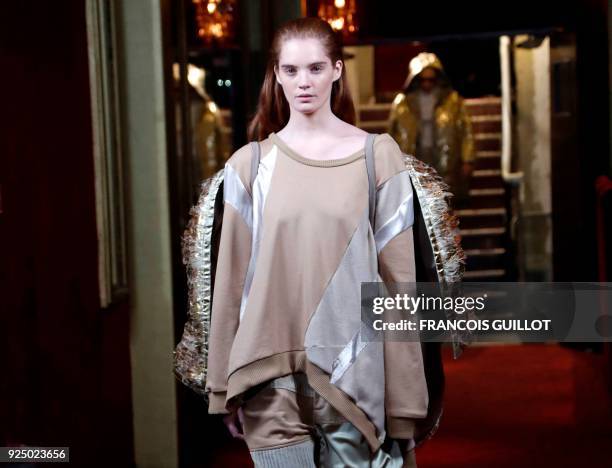 Model presents a creation for Koche during the 2018/2019 fall/winter collection fashion show on February 27, 2018 in Paris. / AFP PHOTO / FRANCOIS...